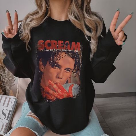 One of my all time favorite halloween movies! Everyone needs a scream movie sweater in their closet 👻 Ghostface is a classic and we love halloween get you a new spooky sweatshirt today #halloween #halloweencostume #halloweenmakeup #fall #fallfashion #falldecor #halloweenideas #spooky #amazon #amazonmusthaves #amazonfba Scream 90s, Scream Billy Loomis, Ig 88, Scary Movie Shirts, Billy Loomis, Horror Movie T Shirts, Scream Movie, 90s Sweatshirt, Scary Movie