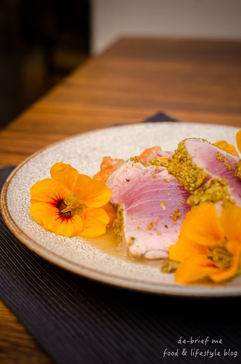 Ottolenghi’s seared tuna with pistachio crust & papaya salsa – tuna never tasted so good. | de-brief me Papaya Salsa, Tuna Loin, Tuna Dishes, Ottolenghi Recipes, Gourmet Food Plating, Mini Cucumbers, Seared Tuna, Pistachios Nuts, Father In Law