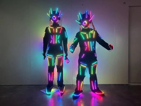 PRICES MAY VARY. Lights both front and nack of costume LED lights change color and can also stay one color It comes with a remote control to control the colors Package Included: 1 x Standard Helmet,1 x Jacket/Armor,1 x Pair of Pants,1 x Remote control Our Size is Smaller than US or European Size,Please send us your height and weight,we will send you the best size to fit you ! Our Size is Smaller than US or European Size, Please send us your height and weight .  we will delivery you the best size Black Light Fashion, Tron Fashion, Glowstick Costume, Galaxy Costume, Light Up Halloween Costumes, Glow Costume, Led Robot, Cyberpunk Costume, Futuristic Costume