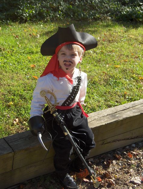 Toddler Pirate costume and I won't need a parrot costume for the baby because we already have an outfit! :) Pirate Costumes Diy, Kids Pirate Costumes, Pirate Toddler Costume, Pirate Costume Girl, Toddler Pirate Costume Diy, Homemade Pirate Costume For Kids, Pirate Costume Toddler Boy, Toddler Pirate Costumes, Baby Pirate Costume Boy