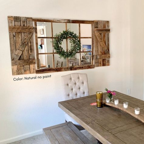 "SO VERY SORRY - WREATH NOT INCLUDED Brighten up your space by placing this farmhouse wall decor mirror  into your living room, entryway or bathroom. Rustic window mirror frame measures 46x36\" PLEASE NOTE: The first image shown is our natural no paint option.  This does not have paint or stain on it and the wood tones will vary greatly for each piece.  ABOUT YOUR MIRROR: DIMENSIONS: Window Mirror 46\"x36\" Shutters 14\"x36\" each - total of 28\"x36\" TOTAL DIMENSIONS MIRROR+SHUTTERS= 74\"x36\" Farmhouse Window Mirror, Shutter Wall Decor, Window Pane Mirror, Shutter Wall, Rustic Shutters, Chic Bedrooms, Rustic Mirror, Farmhouse Mirrors, Farmhouse Window