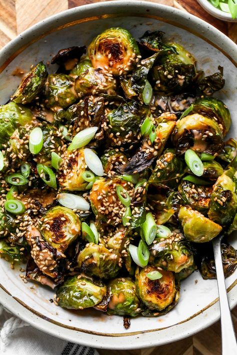 Creamy Sriracha Brussels Sprouts with scallions and sesame seeds comes together in just 30 minutes. This easy side dish recipe pairs well with any protein or entree. Vegetarian, gluten free, and easily made vegan! Tawnie Graham, Balsamic Sauce, Guyanese Recipes, Asian Bbq, Honey Balsamic, Roasted Brussel, Sprout Recipes, Brussels Sprouts Recipe, Veggie Side Dishes