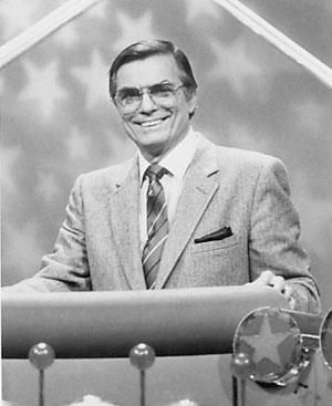 Peter Marshall (born Ralph Pierre LaCock March 30, 1926). He was the original host of The Hollywood Squares, from 1966 to 1981. He has almost fifty television, movie, and Broadway credits. His stage name, Peter Marshall, reportedly derived from the college in his home town (Marshall College, which became Marshall University in 1961). Peter Marshall, Hollywood Squares, Marshall University, Johnny Carson, Home Town, March 30, Stage Name, Rest In Peace, Game Show