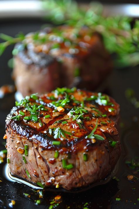 Grilled steaks garnished with fresh herbs. Sirloin Cast Iron Skillet, Italian Filet Mignon, Meals Using Steak, How To Cook Filet Mignon In Cast Iron, Cast Iron Filet Mignon Recipe, Filet In Cast Iron, Filet Cast Iron Skillet, How To Cook A 2 Inch Thick Steak, Steak In A Cast Iron Skillet