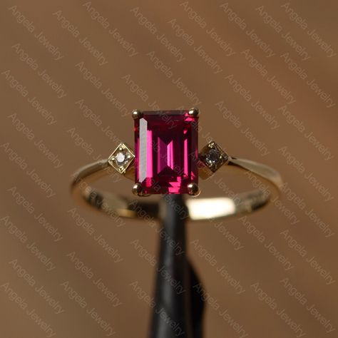 It is a lab ruby ring. The main stone is 6mm*8mm emerald cut lab ruby, weight about 1.68 carats. The basic metal is 14k gold. You can also go to my shop Home for more elegant rings:  https://www.etsy.com/shop/godjewelry?ref=hdr_shop_menu Ruby is the birthstone of July, it will be a great gift for your lover! More ruby rings: https://www.etsy.com/shop/godjewelry?ref=listing-shop2-all-items-count&section_id=20709238 Customization is always welcome and please feel free to contact with me if you hav Ruby Emerald Cut Ring, Ruby Ring Designs, Blue Sapphire Wedding Ring, Silver Ruby Ring, Ruby Wedding Rings, Citrine Ring Engagement, Elegant Rings, Black Spinel Ring, July Birthstone Ring