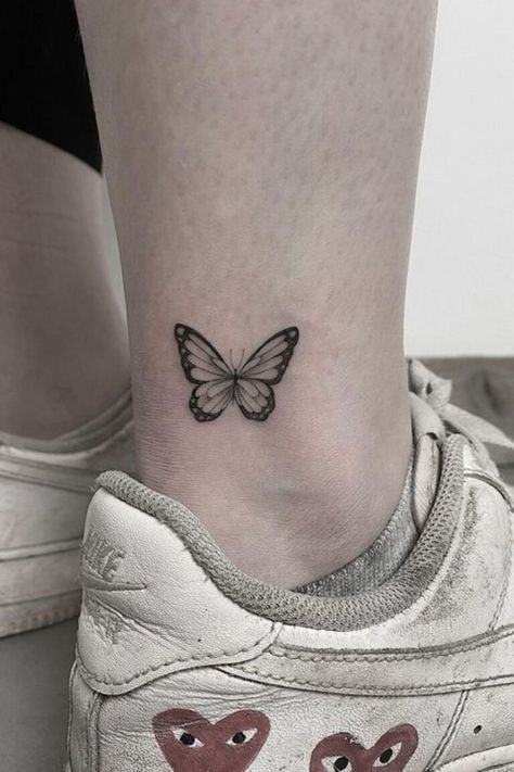 25 Ankle Tattoos For Women To Show Off In 2023 Blue Butterfly Tattoo Ankle, 2023 Tatoos, Simplistic Butterfly Tattoo, Small Monarch Butterfly Tattoo, Butterfly Tattoo On Foot, Small Butterfly Tattoo On Wrist, Butterfly Ankle Tattoo, Small Butterfly Tattoos, Butterfly Ankle Tattoos