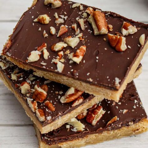 Easy Chocolate Toffee Squares • Flavor Feed Toffee Squares Recipe, Shortbread Toffee Bars, Toffee Pecan Dream Bars, Toffee Bars Recipe, Toffee Squares, Brown Sugar Shortbread, Chocolate Toffee Bars, English Toffee Recipe, Hershey Recipes