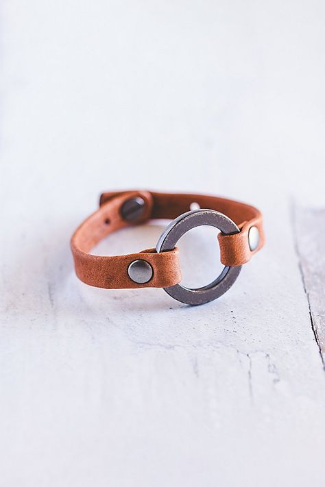 Designed to remind us that we all need to reconnect and ground to nature, our Grounding bracelet is handcrafted from the softest lamb leather and features a chunky antique silver ring with matching rivets. **Contents** * Lambskin leather, zinc alloy hardware * Button clasp closure * Handmade **Care/Import** * Made in the USA **Dimensions** * Adjustable to fit wrist sizes 6.5”-8” | Giving Bracelets Antique Silver Grounding Leather Bracelet at Free People in Orange Leather Bracelet Diy, Rivet Jewelry, Leather Cord Jewelry, Diy Leather Bracelet, Leather Accessories Handmade, Leather Cord Bracelets, Leather Bracelets Women, Antique Silver Rings, Leather Jewellery