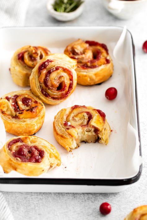 These cranberry brie pinwheels are the perfect treat made easy with store-bought puff pastry, creamy brie cheese, rosemary, and tart cranberry sauce. Brie Pinwheels, Puff Pastry Brie, Pastry Brie, Pastry Pinwheels, Puff Pastry Recipes Savory, Creamy Brie, Puff Pastry Pinwheels, Cream Cheese Pinwheels, Brie Cranberry