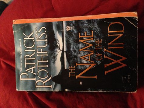 The name of the Wind - Patrick Rothfuss. Recommended by Erin C. Available on Overdrive Patrick Rothfuss Books, The Name Of The Wind, Patrick Rothfuss, Reading Ideas, Book Binding, Book 1, The Wind, Bestselling Author, New York Times