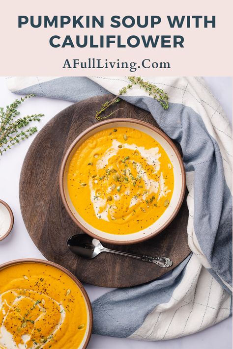 Pumpkin Cauliflower Soup is a hearty, healthy cool weather recipe. It's easy to make with minimal prep time, naturally low carb and gluten free. This velvety smooth soup will be a staple for those chillier days. With plenty of herbs and spices, you will love this warming comfort food. #PumpkinCauliflowerSoup #PumpkinSoup #HealthySoupRecipe Cauliflower Pumpkin Soup, Cauliflower And Butternut Squash Soup, Pumpkin And Cauliflower Recipes, Pumpkin And Cauliflower Soup, Pumpkin Cauliflower Soup, Fall Cauliflower Recipes, Cauliflower Bacon Soup, Pumpkin Cauliflower, Pumpkin Sweet Potato Soup