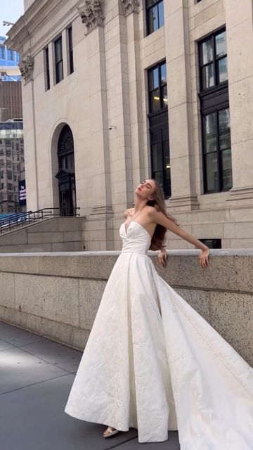 Rita Vinieris on Instagram: "For our elegant and modern brides searching for the perfect dress to compliment their romantic city wedding🤍  Our ‘River’ gown features a strapless V-neck in a stunning jacquard pattern ✨ Finished with buttons down the back, this gown is just waiting for you to say “yes”.  🎥 @bbjeanofficial   #RITAVINERIS #rivini #alyne #rivinifw24 #alynefw24 #nybfw #bridalfashionweek #newyorkbridalfashionweek #fw24bridal #fw24collection #fall2024collection #weddingdressdetails #laceweddingdress #laceweddinggown #satinweddingdress #satinweddinggown #ballgown #weddingballgown #fw24 #fulltullegown #bridalballgown #bridaltrends #newcollection #newcollectionreveal" Rita Vinieris Wedding Dress, Alyne By Rita Vinieris, Poofy Wedding Dress, Ivory Ball Gown, Timeless Wedding Gown, Rita Vinieris, Classic Wedding Gown, Unique Wedding Gowns, Satin Wedding Gown