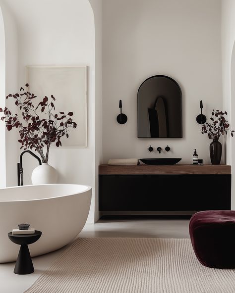 These stunning interiors show how a deep burgundy accent can transform a space.🤌🏻🍷 The rich velvet chairs and pillows pop against the soft neutrals, creating a perfect balance of warmth and sophistication. The dark red details, from the lush upholstery to the elegant rugs, bring a sense of depth and elegance without overpowering the minimalist design. Paired with sleek black furniture and subtle art pieces, the space feels both modern and timeless.✨ #minimalistinterior #minimalisthome #mi... Burgundy Interior Design, Burgundy Bathroom, Elegant Rugs, Chill Space, Minimalist Glam, Monochromatic Interior, Velvet Chairs, Elegant Minimalism, Airbnb Design