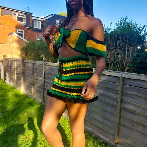 This beautiful matching set made in acrylic yarn would be perfect for the occasion of a festival, party or any other reason to dress up. It features the colours of the Jamaican flag, so you can represent the culture in style. Top: 6/8 UK Skirt: 6/8 UK why you should get this? - perfect for a celebration such as festival season, carnival or a party - made in acrylic yarn - soft and lightweight - reversible top - off the shoulder sleeves - drawstring skirt ABOUT ME: La.crochets is a small business which loves to design and create intricate, modern and stylish pieces for people just like you. I began crocheting in the year of 2020, and have experience in making products from beanies to dresses. Personalised and custom pieces are also a favourite of mine, so you can get treat yourself or gift Jamaican Colors, Matching Crochet, Crop Top And Skirt Set, Notting Hill Carnival, Jamaican Flag, Crop Top And Skirt, Reversible Top, Green Crochet, Top And Skirt Set