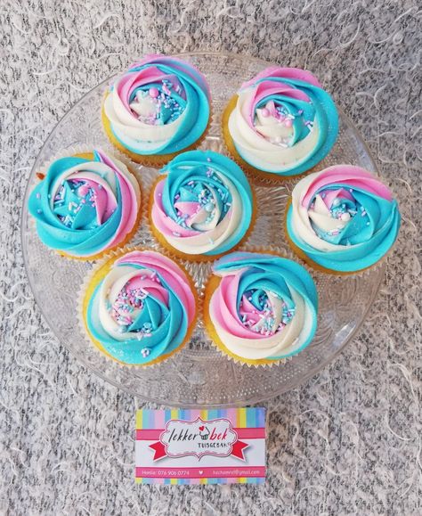 Vanilla cupcakes with with blue pink and white rainbow buttercream swirl Pink And Blue Frosting Cupcakes, Pink And White Swirl Cupcakes, Pink And Turquoise Cupcakes, Pink And Blue Barbie Party, Pink Purple Blue Cupcakes, Pink And Blue Swirl Cupcakes, Pink Blue Cupcakes, Pink And Blue Cupcakes, Turquoise Cupcakes