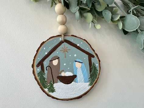 Easy Painted Wooden Ornaments, Hand Painted Nativity Ornament, Wooden Ornament Painting, Things To Paint And Sell, Painted Christmas Ornaments Wooden, Wood Ornament Painting Ideas, Wooden Painted Ornaments, Hand Painted Ornaments Wooden, Wooden Ornament Ideas