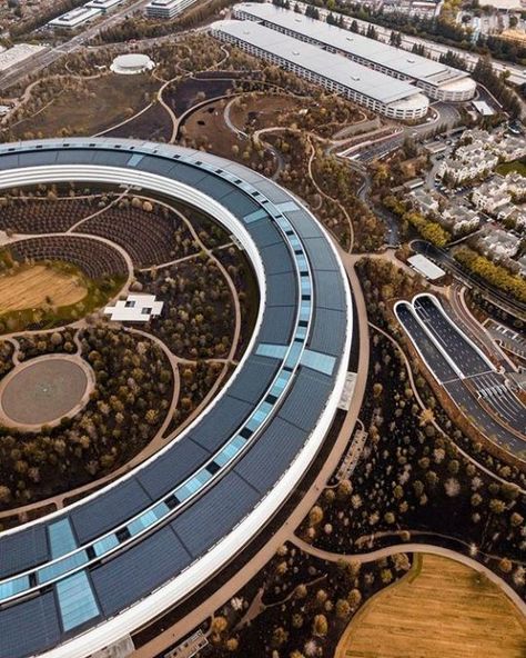 Apple Park is the corporate headquarters of Apple Inc. It was opened to employees in April 2017, while construction was still underway. The main building's scale and circular groundscraper design have earned the structure a media nickname "the spaceship". It houses more than 12,000 employees in one central four-story circular building. Apple co-founder Steve Jobs wanted the campus to look less like an business park and more like a nature refuge. Apple Hq, Cupertino California, Cinema Center, Circular Buildings, Apple Park, Corporate Headquarters, Apple Inc, Palau, Steve Jobs