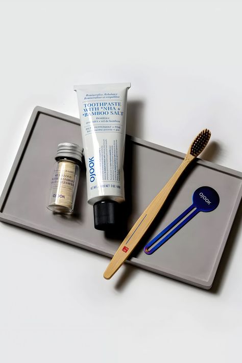 Featuring Bamboo Salt Toothpaste, a Bamboo Toothbrush, and Silk Floss infused with nano-hydroxyapatite (nHA) and Korean 9x roasted bamboo salt. 🌟🔍 Designed to nurture a healthy oral microbiome and prevent cavities, these products maintain the highest sustainability standards. Embrace a natural approach to oral health. Explore this comprehensive guide on Ojook available on Marmalade for expert insights. 📌🌐 #OralCare #BambooToothpaste #BambooToothbrush #EcoFriendly #NanoHydroxyapatite Marvis Mouthwash, Travel Toothbrush And Toothpaste, Sustainable Toothbrush, Bamboo Toothbrush Packaging, How To Prevent Cavities, Bamboo Toothbrush, Hygiene Routine, Rituals Set, Healthy Smile