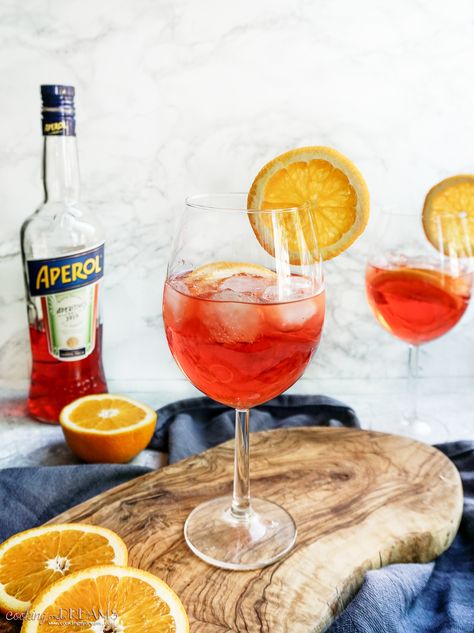 Aperol Spritz is the classic Italian Aperitivo made with Prosecco, Aperol and soda, following the traditional recipe. It's sparkling, fresh, lightly bitter and lightly citrusy. It's the perfect drink to enjoy outside in the nice sunny weather with a few snacks, just like in Italy. What Is Prosecco, Italian Aperitivo, Aperol Spritz Recipe, Spritz Recipe, The Cookie Rookie, Cookie Rookie, Colorful Drinks, Summer Cocktail Recipes, Sweet Wine