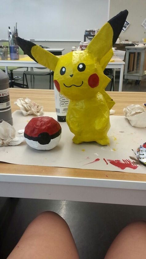 Paper mache pikachu Paper Mache Pokemon, Pokemon Crafts, Homemade Christmas Crafts, Pokemon Craft, Newspaper Basket, Cardboard Art, Classroom Resources, Paper Clay, Paper Beads