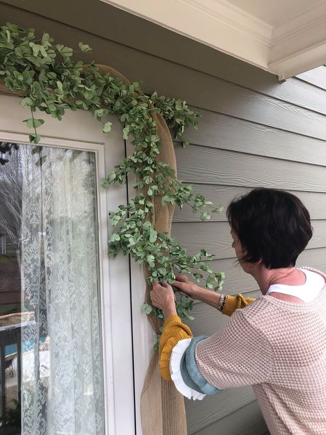 Front Porch Ideas For Easter Spring Decorations, Above The Front Door Decor Outside, Front Door Flower Arrangements, Vines Around Front Door, Front Door Floral Arrangements Entrance, Outdoor Front Door Garland, A Frame Front Door, Boutique Front Door Entrance, Front Door Porch Decor Ideas