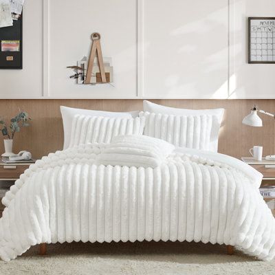 You won't be able to stop running your hands through this fabric! Our Everett comforter set is made with a luxurious faux fur fabric with an incredibly soft feel. The set is backed with our "micro mink" fabric that creates a reversible option to this set. The included 20x20 decorative pillow adds a great value to this set. | Mercer41 Hegg Channel Faux Fur White 4 PC Comforter Set White | Home Decor | C110802997_243013161_243013174 | Wayfair Canada White Comforter Bedroom, Chambre Inspo, Comforter Bedding, Twin Xl Comforter, Dorm Inspo, Bed Comforter Sets, White Comforter, Comforter Bedding Sets, Fur Fabric