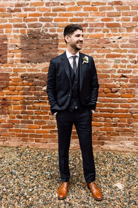 Groom style: black suit, brown leather shoes | Image by Plum & Oak Photo Black Suit Brown Shoes, Moroccan Inspired Decor, Groom Suit Black, Suit Brown, Brown Shoes Men, Black And White Suit, Black Suit Men, Earthy Style, Brown Accessories