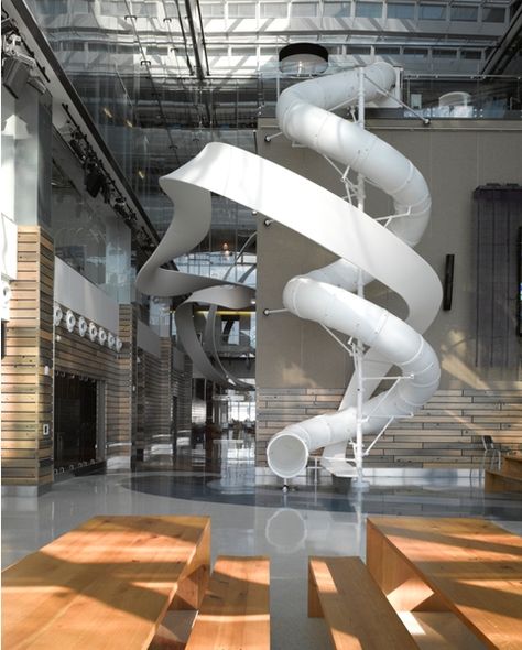 A slide! For the days when you just want to get home quickly. (Corus Entertainment Office) مركز ثقافي, Future Office, Indoor Slides, Creative Office, Student Living, Terrazzo Flooring, Interior Design Companies, Office Interior Design, Commercial Design