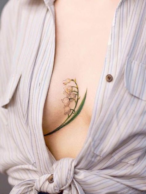 50+ beautiful and gentle lily of the valley tattoos: designs in different styles on different body places are in our article. Bonus: secret tattoo meanings Wedding Text, Secret Tattoo, Mastectomy Tattoo, Planet Tattoos, Underboob Tattoo, Gorgeous Tattoos, Lily Tattoo, Sternum Tattoo, Badass Tattoos