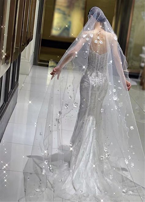 "Wedding Veil 2023 Color: white Fabric: tulle, flower Applicable scene: wedding  Length: 137\"  width 118\"                                                                                                                            The veil is made of tulle, I think you might like it. You'll look elegant in it. This veil is very sparkly and it will make you look even more dazzling on your wedding day. The wedding veils we make are the same as the pictures. Marriage is a very important thing, I think you must want to have a perfect wedding, hope to buy a perfect veil. You can consider choosing us, we will provide you with the best quality service. If you don't know how to choose the right color,  you can place an order to buy a color card, we have four colors for you to choose. We can custom Lace Veils Bridal, Sparkle Wedding Dress, Wedding Veil Accessories, 2023 Color, Sparkly Wedding, Bridal Veils, Sparkle Wedding, Pearl And Lace, Luxury Bridal