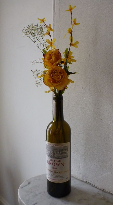 wine bottle with flowers @Heather Creswell Brown Dried Flowers In Wine Bottle, Flowers In A Wine Bottle, Wine Bottle As Vase, Flower In Wine Bottle, Flowers In Wine Bottles, Wine Bottle Flower Arrangements, Wine Bottle With Flowers, Diy Wine Tasting Party, Flowers In Bottles