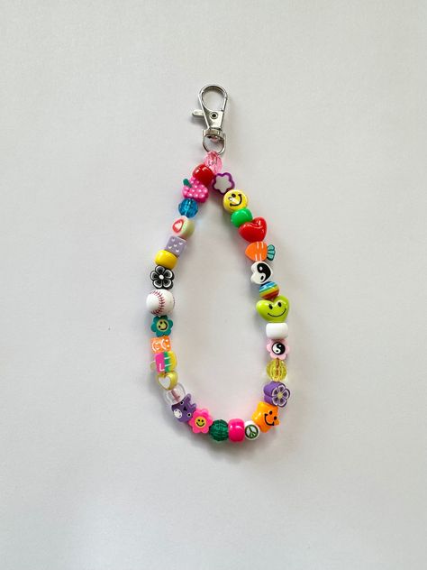 You will receive 1 random mix keychain wristlet/bag charm beaded by me with luuvvvv and will look similar to those pictured <3  Can put a custom name/word in block letters or no personalization at all! ️🌼 Length is measured straight across, design will be 6" in size. Pearl Phone Charm, Smiley Design, Hip Jewelry, Bead Keychain, Bottle Cap Art, Keychain Wristlet, Wristlet Bag, Beaded Keychain, Block Letters