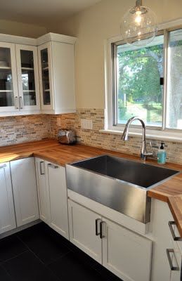 Butcher block countertops and stainless apron sink. Stainless Apron Sink, Farmhouse Kitchen Countertops, Ikea Style, Wood Countertop, Butcher Block Counter, Apron Sink, Stainless Kitchen, New Countertops, Magnolia Market