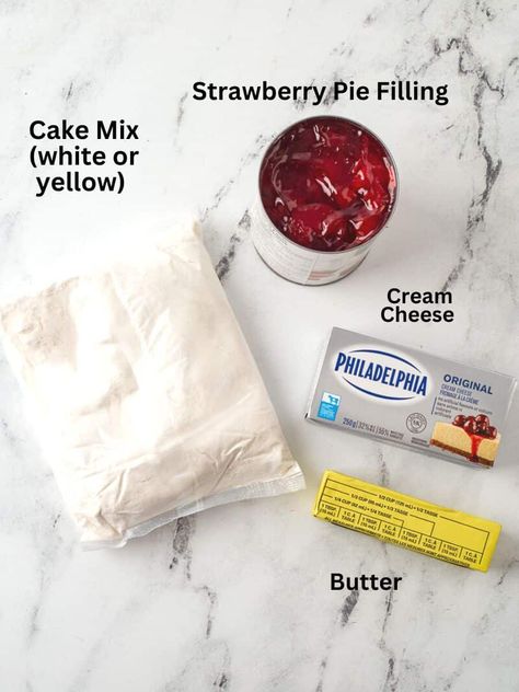 Strawberry Cream Cheese Dump Cake (4 Ingredients) | She's Not Cookin' Cream Cheese And Cake Mix Desserts, White Cake Dump Recipes, Cherry Dump Cake With Cream Cheese, Cream Cheese Dump Cake Recipes, Strawberry Dump Cake 3 Ingredients, Strawberry Dump Cake Recipes, Strawberry Cream Cheese Dump Cake, Raspberry Dump Cake, Strawberry Lemon Pie