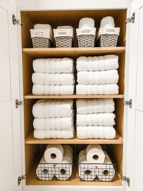 Bathroom cabinet organization  before and after with new decorative bathroom storage bin on our bathroom shelves. #bathroom #organization Bathroom Organization Storage Bins, Towel Cabinet Organization, Tall Towel Cabinet, Body Scrub Organization, Bathroom Storage Bins, Towel Cabinet Bathroom, Bathroom Cabinets Organization, Small Bathroom Organisation, Bathroom Shelving Ideas Storage