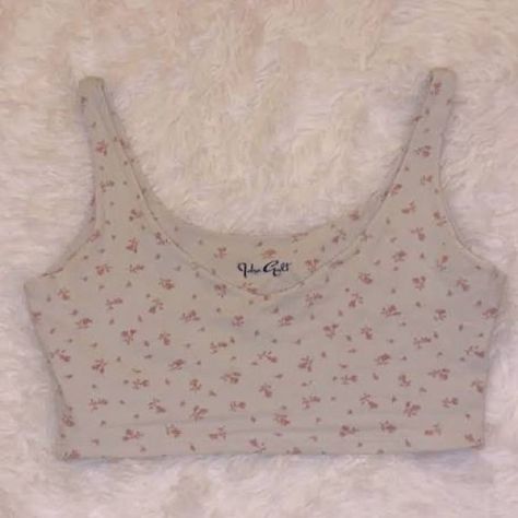 Brand New With Tags!! Brandy Melville John Galt Cropped Pink Flower Tank Os The "Brandy Melville John Galt Cropped Pink Flower Tank" Is A Trendy And Stylish Top From Brandy Melville's John Galt Collection. This Tank Top Features A Cropped Design, Making It Perfect For Pairing With High-Waisted Bottoms. The Pink Flower Print Adds A Feminine And Playful Touch To The Overall Look. Brandy Melville Is Known For Its Fashionable And Youthful Designs, And The John Galt Collection Is No Exception. Whethe Brandy Melville Sweater, Brandy Melville Tank Top, Pink Flower Print, Cropped Pink, White Lace Tank Top, Cream Tank Top, Pink Floral Top, White Crop Tank, Floral Print Crop Top