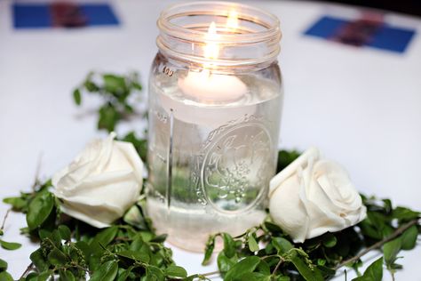 Mason Jar With Floating Candle, Mason Jars With Floating Candles, Mason Jar Candle Centerpieces, Mason Jar Floating Candle Centerpieces, Mason Jar Floating Candles, Tea Candle Centerpieces, Floating Candles Mason Jars, Jar Centerpiece Wedding, Barn Table