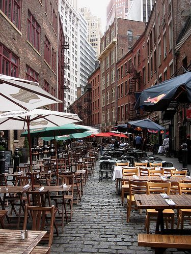 Stone Street Lower Manhattan, New York. Originally called Brewers St., this is the first paved street in New York (hence the name "Stone"). The buildings largely date soon after the Great Fire of 1835, which devastated the neighborhood.   #NYC #newyorkcity #newyorkphotography Stone Street Nyc, Battery Park City, Summer Vision, Stone Street, Battery Park, The Great Fire, Manhattan Nyc, New York City Travel, Ny City