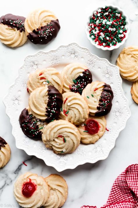 These homemade Christmas butter cookies are extra soft and buttery with delicious vanilla almond flavor and a dunk in dark chocolate. Pipe into desired designs or even use a cookie press! Recipe on sallysbakingaddiction.com Danish Butter Cookies Recipe, Butter Cookie Recipe Easy, Cookie Recipe Video, Danish Butter Cookies, Plain Cookies, Sally's Baking, Spritz Cookies, Best Christmas Cookies, Butter Cookies Recipe