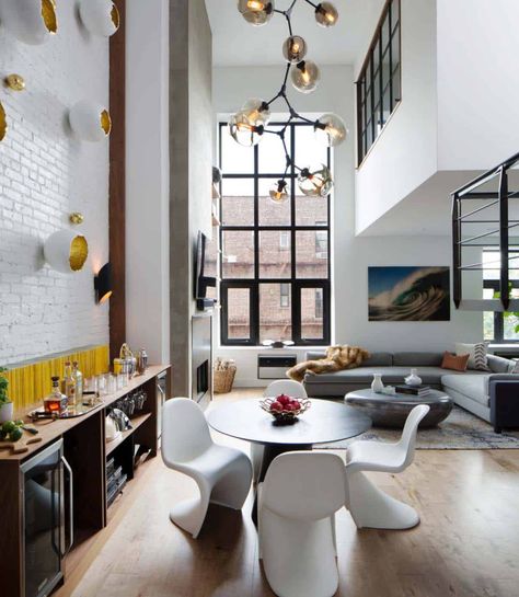 Chic and stylish duplex renovation in SoHo, New York Double High Living Room, Living Room White Walls, Eclectic Light Fixtures, Eclectic Lighting, Light Hardwood Floors, Room White, Urban Loft, Loft Living, Living Room White