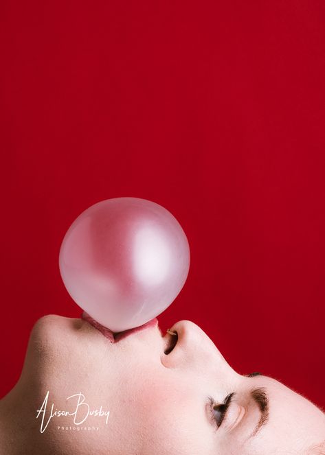 Alternative portrait featuring girl blowing pin bubble against red backdrop Bubble Gum Photography, Bubble Gum Photoshoot, Blowing Bubble Gum Aesthetic, Bubble Gum Portrait, Blowing Bubble Gum Photography, Bubble Gum Blowing, Beauty Head Shots, Girl Blowing Bubble Gum, Blowing Bubble Gum