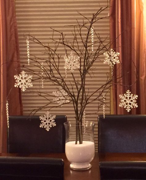 Branches, Epsom salt, snowflake and icicle ornaments as a centerpiece. Winter Wedding Tall Centerpieces, Church Winter Decorations, Snowflake Table Decor, Snowflake Table Centerpieces, Snowflake Centerpieces Wonderland, January Centerpiece Ideas, Snowflake Party Decorations, Snowy Centerpieces, January Centerpieces