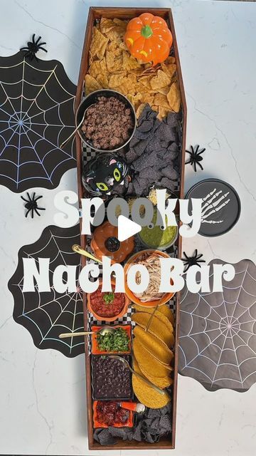 Shahla Sandoval on Instagram: "My favorite Halloween hack was turning this coffin-shaped sign into my personal nacho bar / charcuterie board / movie night board a few years back. You can leave it unfinished or stain it with coffee like I did. It’s not food safe so I always use parchment paper. The Halloween Nacho Bar is a crowd favorite and perfect for your Halloween parties or if you want to feed a crowd before trick or treating.  I bought my untouched coffin sign a few years back and they’ve since changed it a bit. I’ve linked it and all the details on my blog. Comment nacho and you’ll be send the blogpost. #halloweendecor #halloweenpartyideas #halloweenpartyfood #halloweenparty" Charcuterie Board Movie Night, Halloween Nacho Bar, Bar Charcuterie Board, Movie Night Board, Coffin Sign, Nacho Bar Party, Chili Bar Party, Halloween Chili, Halloween Movie Night Party