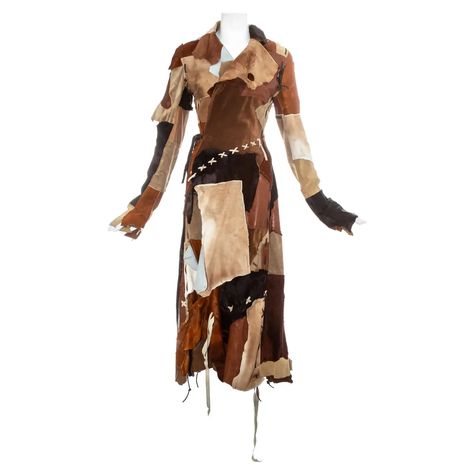 For Sale on 1stDibs - Dolce & Gabbana goat hide and leather patchwork coat with wrap fastening on the waist, raw edges and leather blanket stitches and tassels throughout. Fall-Winter Upcycled Coat, Patchwork Leather Jacket, Wool Maxi Coat, Blanket Stitches, Dream Wishlist, Upcycle Clothes Diy, Patchwork Coat, Dream Fashion, Leopard Print Coat