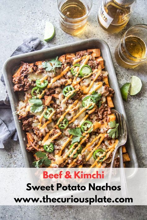 Beef and Kimchi Sweet Potato Nachos are an easy and cheesy twist on classic nachos. Made with Korean-inspired barbecue ground beef, kimchi, roasted sweet potatoes and topped with a decadent sauce. These nachos will hit the spot any night of the week. Shrimp Appetizers Easy, Easy Bruschetta, Sweet Potato Nachos, Dip Recipes Easy, Vegetarian Appetizers, Hearty Dinner, Dessert Appetizers, Roasted Sweet Potatoes, Kimchi