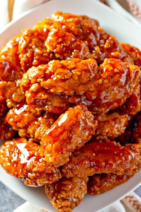 Sweet and spicy sticky chicken tenders are coated in an addictive sauce featuring a blend of BBQ sauce, hot sauce, and brown sugar. Using store-bought chicken tenders, these spicy chicken tenders are super easy-to-make, with just 5 ingredients, in 20 minutes! #EasyDinnerIdea Chicken Tenders Oven Baked, Sweet And Spicy Sticky Chicken, Sticky Chicken Tenders, Spicy Sticky Chicken, Chicken Tenders Oven, Spicy Chicken Tenders, Sweet And Spicy Chicken, Chicken Balls, Fried Chicken Tenders