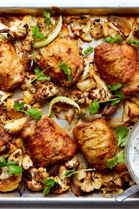 Roasted Chicken Thighs With Cauliflower and Herby Yogurt Recipe - NYT Cooking Crispy Roasted Chicken, Meat Entrees, Paleo Ideas, Dinners Recipes, Meat Dish, Yogurt Recipe, Roasted Chicken Thighs, Spanish Recipes, Pan Dinners