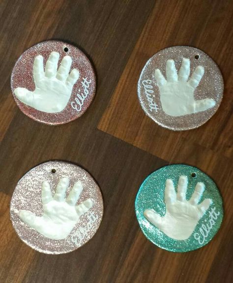 Crayola air dry clay and acrylic paint (pearl white for the hand and glitter paint for the outside).  The glitter paint really did take about a million coats to get total coverage but I think the finished product is worth it.  I'm going to put white ribbons through the top. Air Dry Clay Ornaments Baby, Crayola Air Dry Clay Handprint, Crayola Air Dry Clay Ornaments, Air Clay Ornaments, Crayola Air Dry Clay, Clay Handprint, Grandparents Ornament, Air Dry Clay Projects, Clay Crafts Air Dry