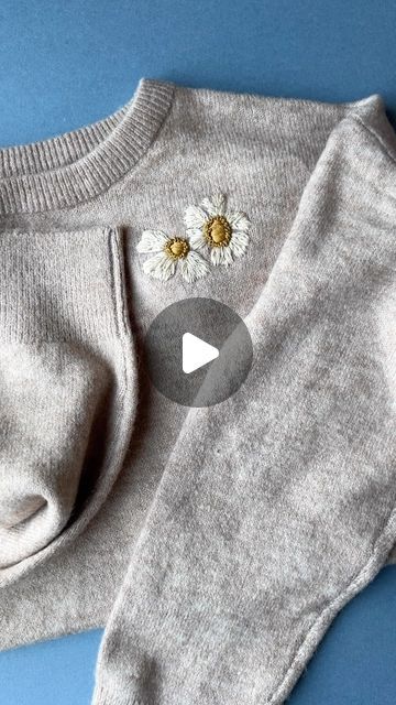 Jenny ~ Embroidery Art, Design & Crafts on Instagram: "Using soluble paper to mend a hole! I found this worked so well on knitwear, both as a template and a stabiliser 💛 . . #upcycledclothing  #upcycledfashion  #embroideredflowers  #embroideredclothing  #embroidereddenim  #embroideredclothes  #embroideredflorals  #learntoembroider  #mindfulart  #slowstitching  #sewingproject  #embroiderypatterns  #bordadolivre  #createdtocreate  #diycrafts  #slowcraft  #dmcthreads  #dmcembroidery  #springflowers  #embroiderydesign  #beginnerembroidery  #embroiderywork  #denimembroidery  #sustainablefashion  #embroiderhappyhoops  #embroiderytutorial  #embroideryprocess  #embroideryproject  #handsew" Learning To Embroider, Denim Embroidery, Upcycled Fashion, Slow Stitching, Embroidered Clothes, Embroidery Hoop Art, Embroidery For Beginners, Embroidered Denim, Embroidery Tutorials