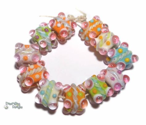 "These can be made as matched pairs, too! Contact me if you need them paired for earrings! Included are 11 lampwork beads handmade by me in my studio. These are Made to Order and are like the beads above, but will vary slighly since they are handmade - These beads are made with a mix of candy colors.Periwinkles, pinks, ivory, melon, blue, and purples make up solid bases, with twisties wraps and plunged eyes on the corners. Very cool beads, would be beautiful in a winter bracelet! The beads are a Winter Bracelet, Trollbeads Bracelet, Purple Set, Weird Jewelry, Pastel Candy, Candy Jewelry, Sugar Cubes, Funky Jewelry, Color Mix